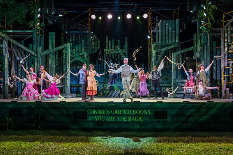 Full company on an outdoor stage